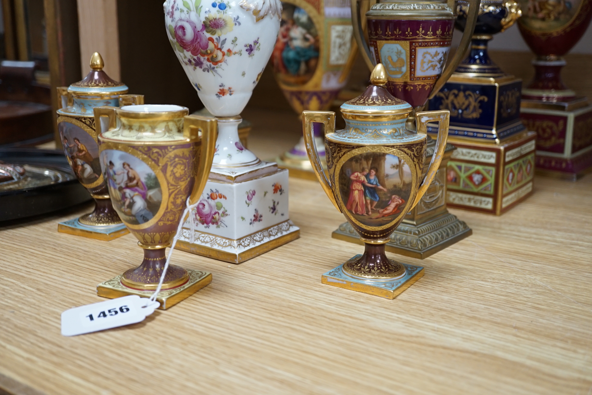 Ten Vienna type porcelain and brass pedestal vases, six with covers, largest 29cm high
